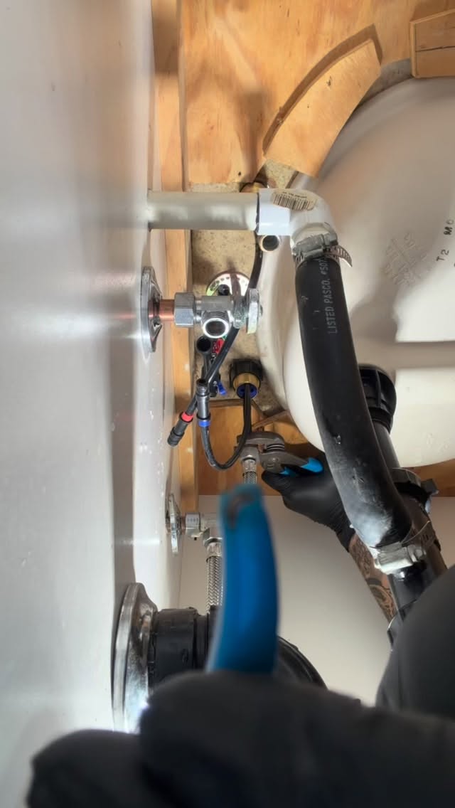 Drain repair work under a sink